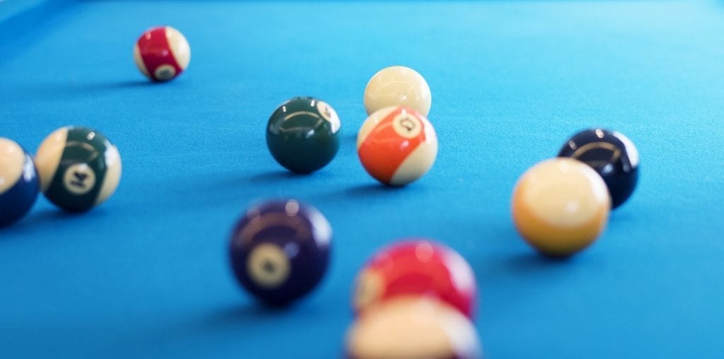 Billiard balls on a pool table